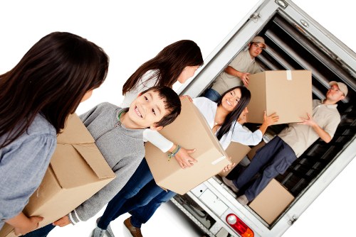 Van moving team preparing safe lifting procedures