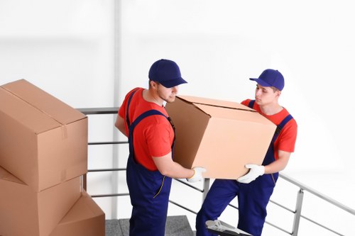 Man with a van loading furniture in Wanstead
