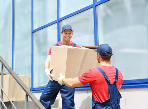 House movers working near a residential street in Wanstead