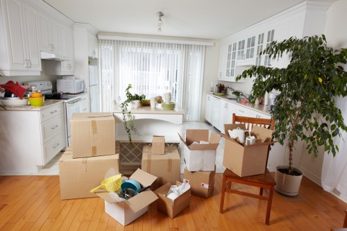 Packed moving boxes and household items ready for transport in Wanstead