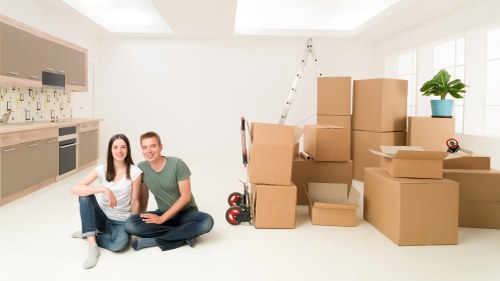 Movers handling a flat removal with careful access planning
