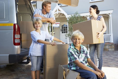Packed household boxes and protective materials ready for removal