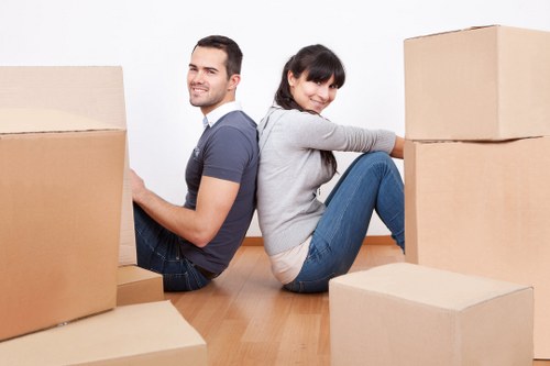 Local moving truck handling furniture and boxes in Wanstead