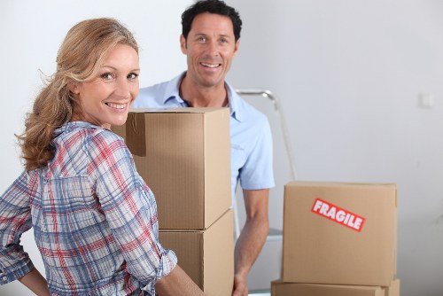 Loading household items into a van for a Wanstead move