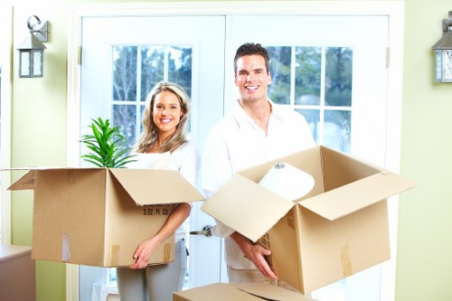 Removals team preparing furniture for transport on a Wanstead street